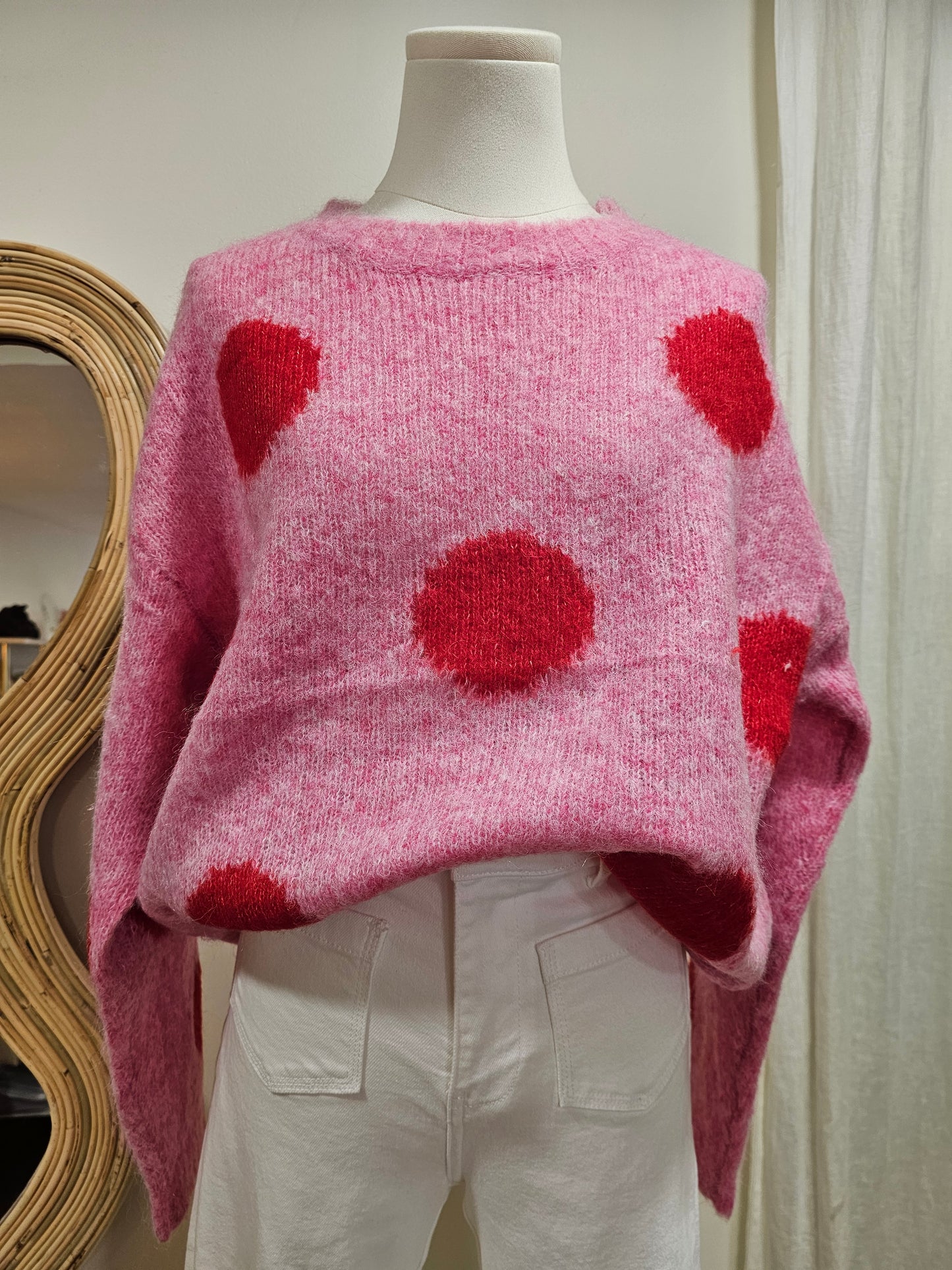 Pull à pois rose et rouge